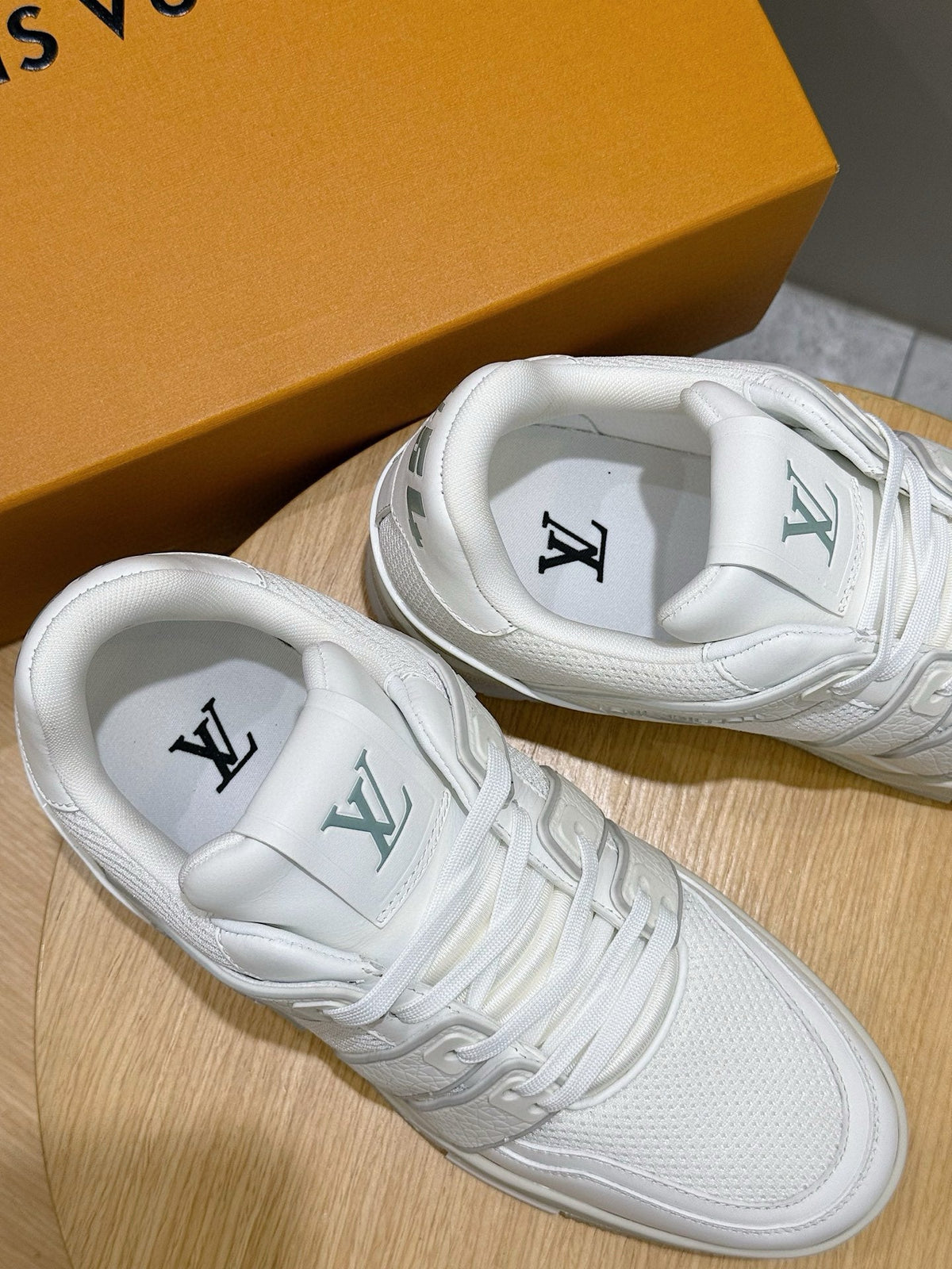 LV Trainer Sneakers Resting In White Colorway