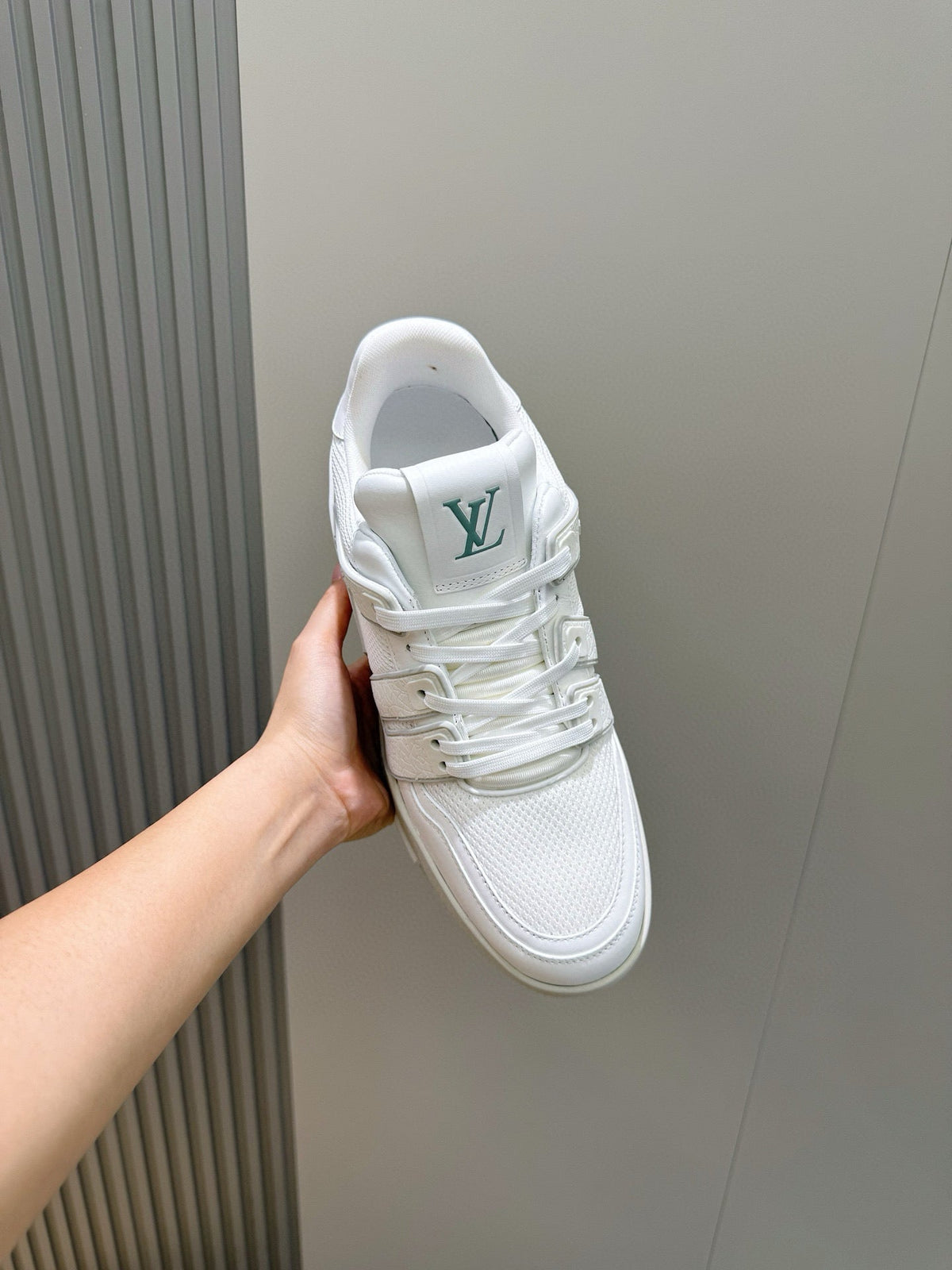 LV Trainer Sneakers Resting In White Colorway