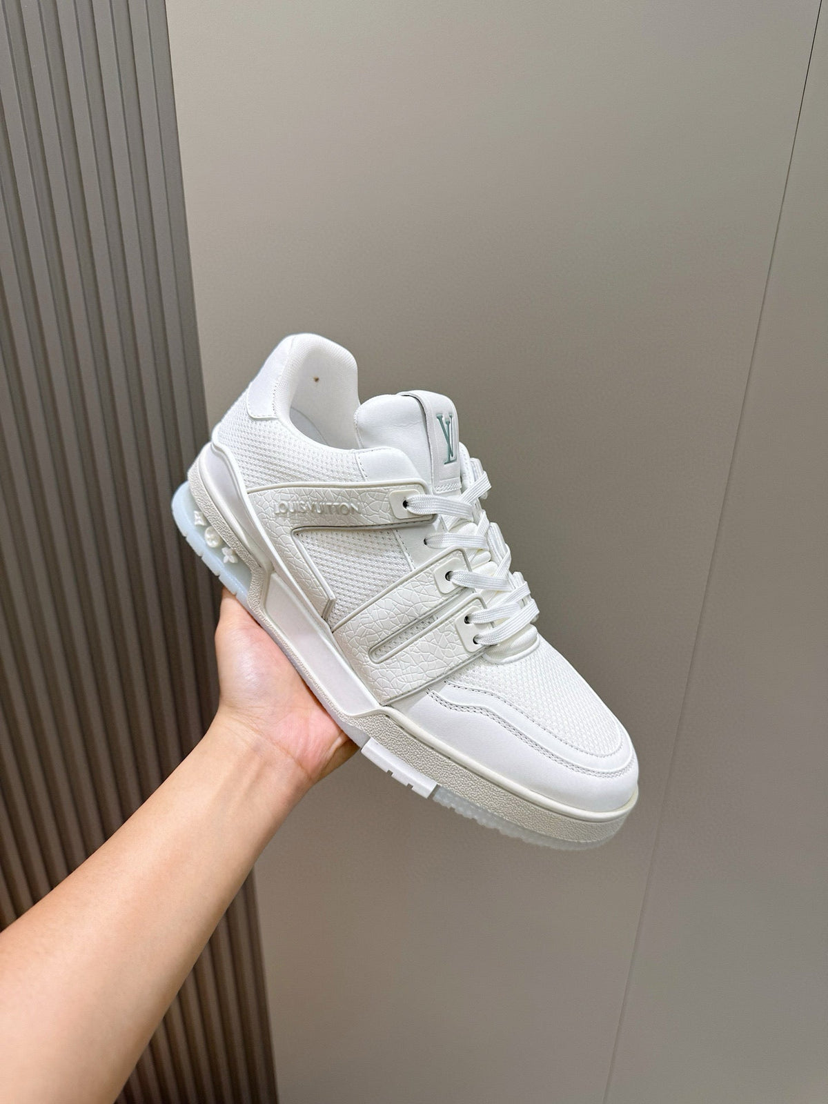 LV Trainer Sneakers Resting In White Colorway