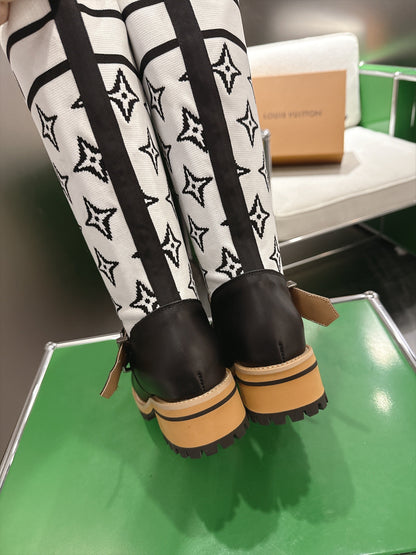 Tall Boots With Striking Black Lower Boot with White Monogram Shaft