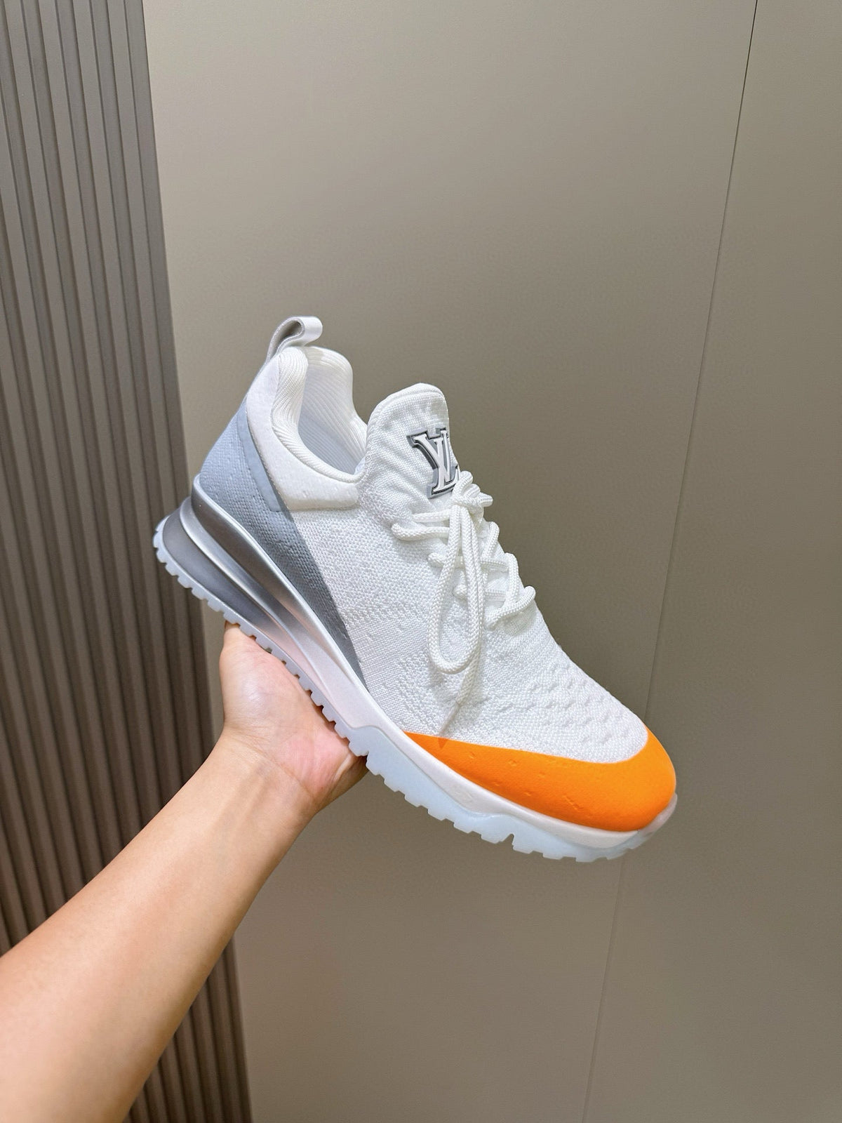 LV Runner Sneakers Featuring An Orange Toe Cap And a Silver Heel Accent