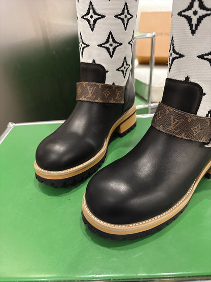Tall Boots With Striking Black Lower Boot with White Monogram Shaft