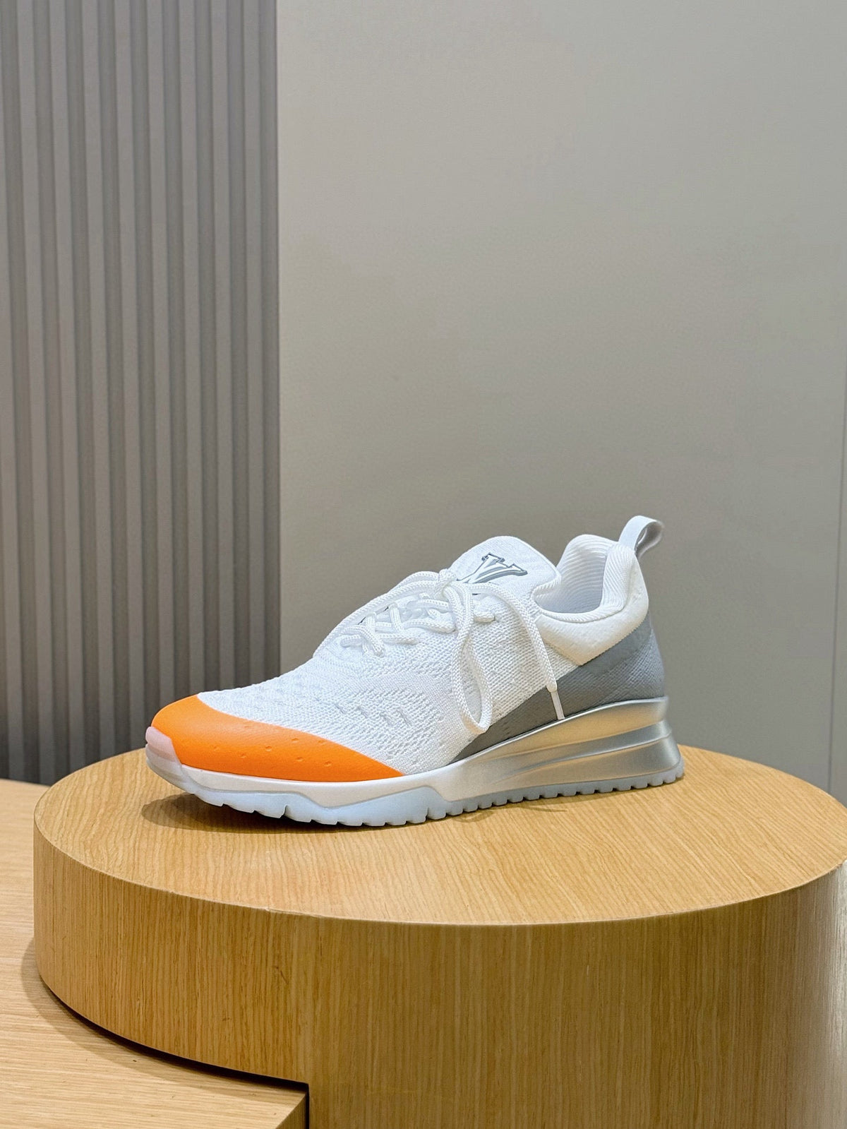 LV Runner Sneakers Featuring An Orange Toe Cap And a Silver Heel Accent