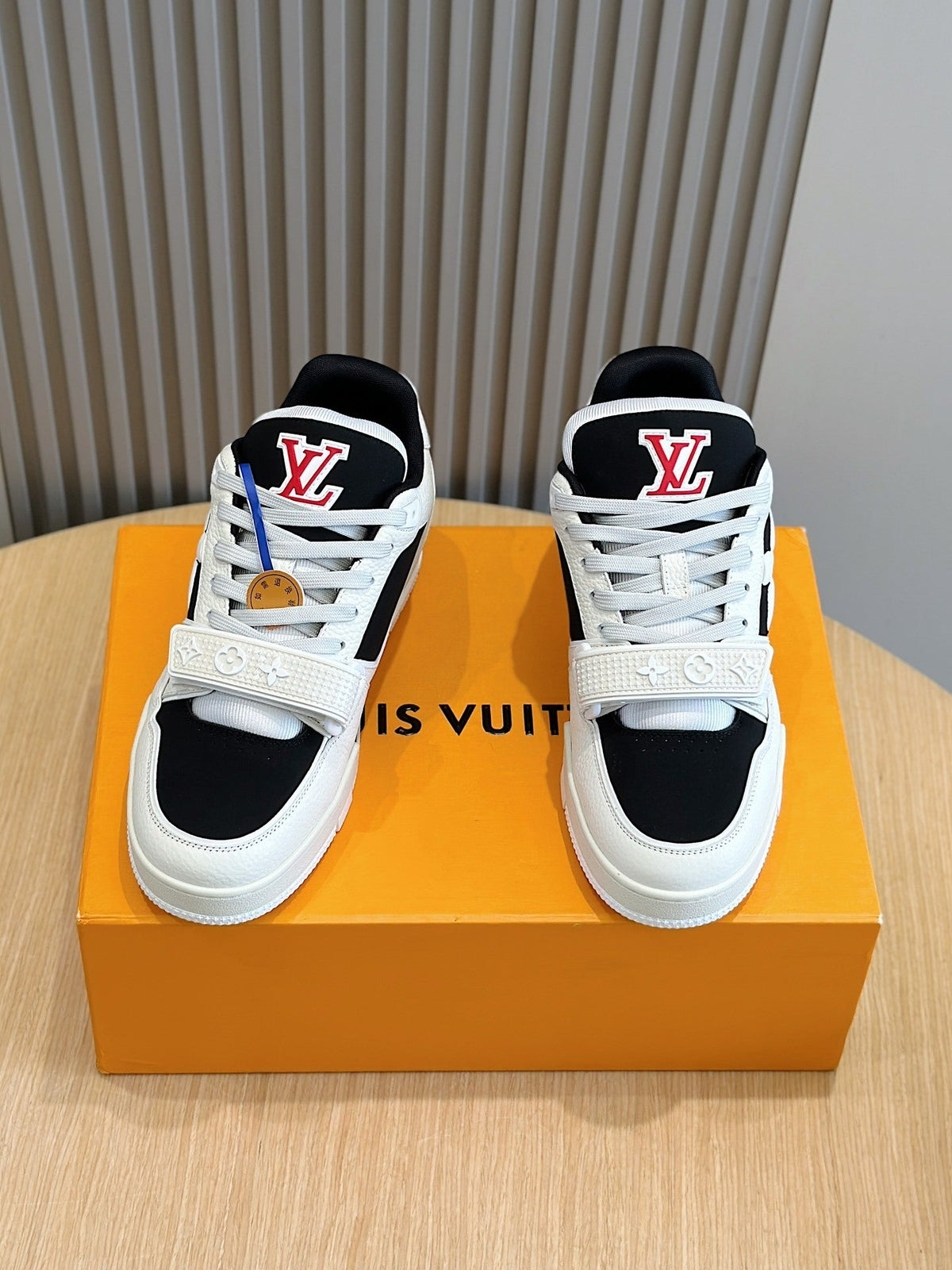 LV Trainer Sneakers In Cream And Black Colorway