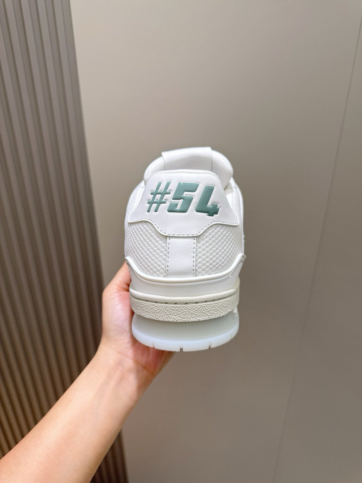 LV Trainer Sneakers Resting In White Colorway