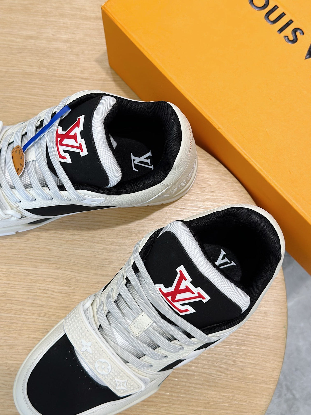 LV Trainer Sneakers In Cream And Black Colorway