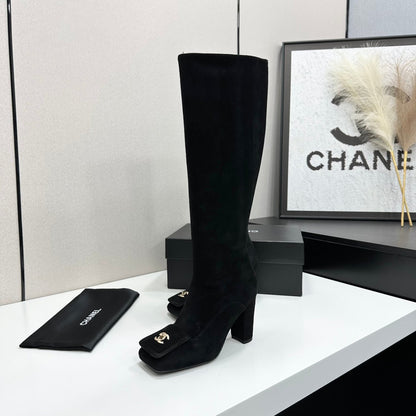Black Suede Knee-High Heeled Boots Featuring A Square Toe And Gold-Toned Buckle Detail