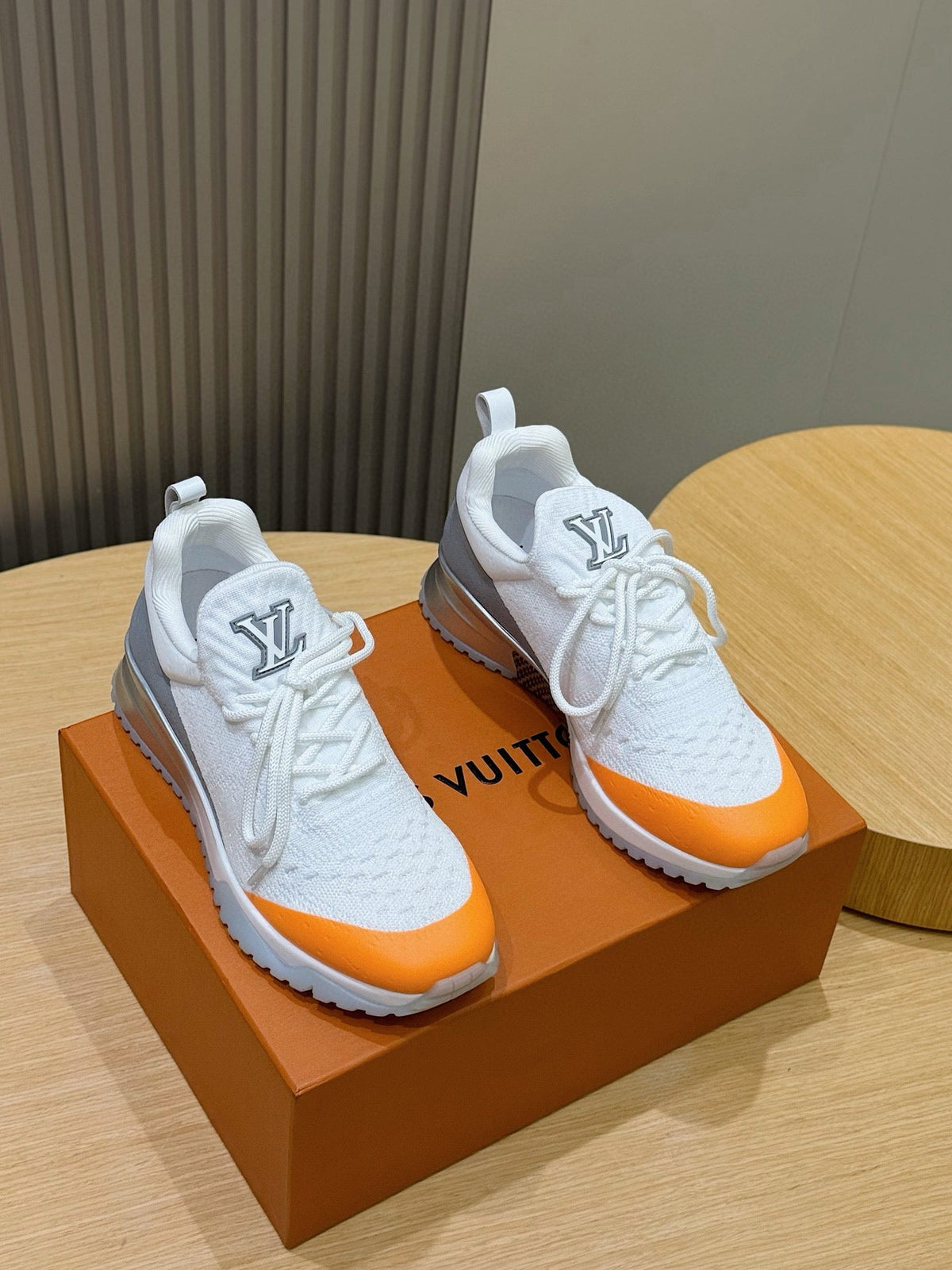 LV Runner Sneakers Featuring An Orange Toe Cap And a Silver Heel Accent
