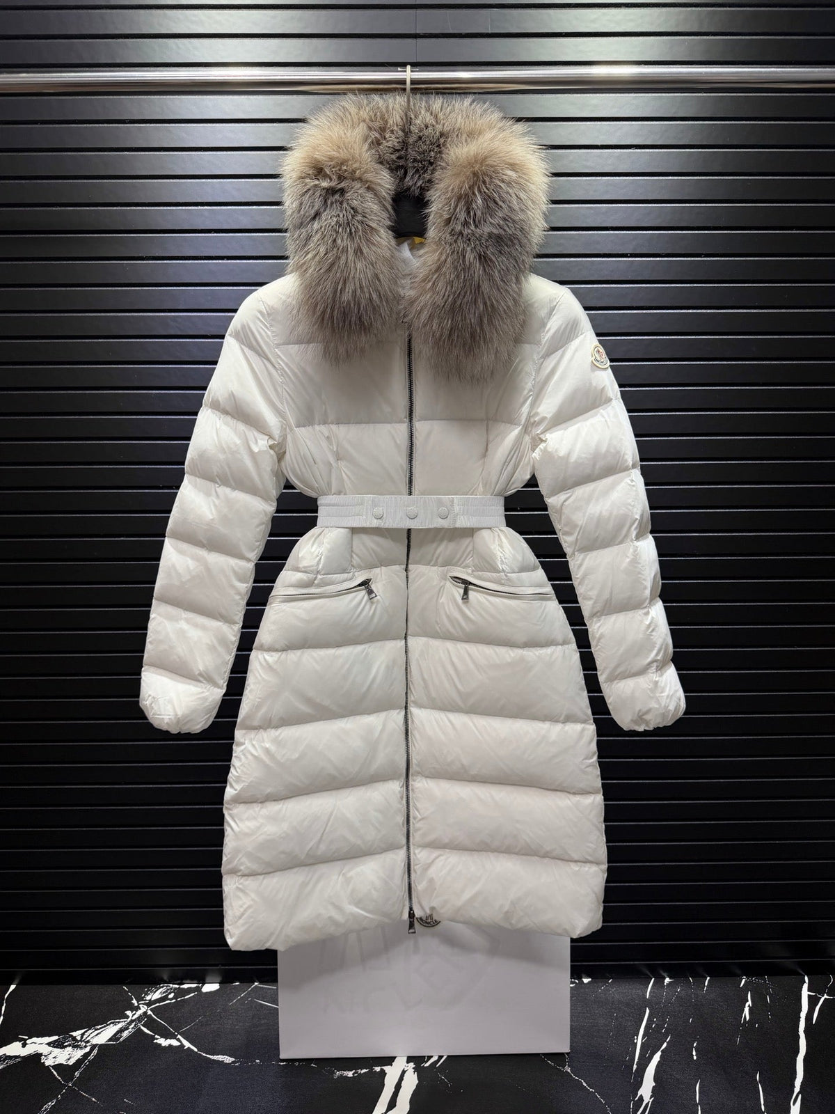 Long White Quilted Down Coat Featuring A Belted Waist And a Fur-Trimmed Hood