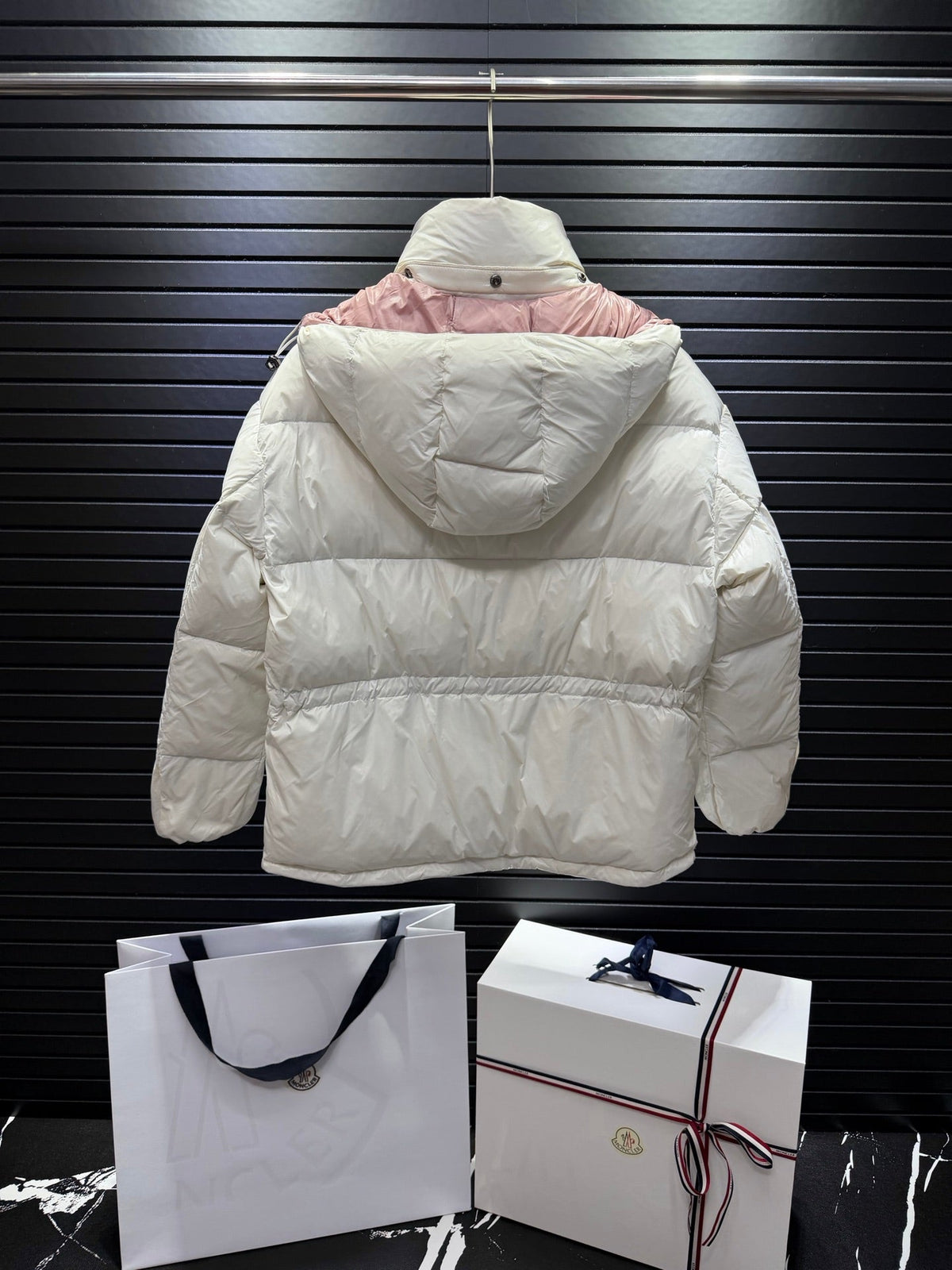 White And Pink Short Puffer Jacket With Embossed Letter Branding On The Chest